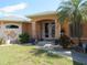 Well-manicured lawn leads to the front entrance of this charming single-story home at 1500 Westover St, Port Charlotte, FL 33953