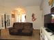 Inviting living room with a comfortable couch, neutral color palette, and ample natural light at 1500 Westover St, Port Charlotte, FL 33953