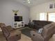 Comfortable living room with modern furnishings, neutral colors, and open layout at 1500 Westover St, Port Charlotte, FL 33953