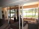 Screened patio area featuring cozy seating, jacuzzi, and outdoor living space at 1500 Westover St, Port Charlotte, FL 33953