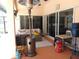 Inviting covered patio featuring comfortable seating and a cozy outdoor heating, perfect for relaxation at 1500 Westover St, Port Charlotte, FL 33953