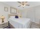 Comfortable bedroom featuring a ceiling fan, neutral walls, and ample closet space at 1601 Park Beach Cir # 114/4, Punta Gorda, FL 33950