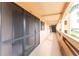 Hallway to unit door with storm door at 1601 Park Beach Cir # 114/4, Punta Gorda, FL 33950