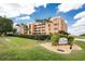 Beautiful condo building with well-manicured landscaping and mature trees creates an inviting and luxurious entrance at 1601 Park Beach Cir # 114/4, Punta Gorda, FL 33950