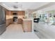 Well-equipped kitchen boasts wood cabinetry, stainless steel appliances, and a cozy breakfast bar at 1601 Park Beach Cir # 114/4, Punta Gorda, FL 33950