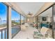 Screened lanai overlooking the pool and waterfront offers seating and serene outdoor living space at 1601 Park Beach Cir # 114/4, Punta Gorda, FL 33950