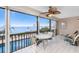 Enjoy the tranquil lanai with relaxing seating and panoramic water views overlooking the pool and bay at 1601 Park Beach Cir # 114/4, Punta Gorda, FL 33950