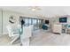 An airy living room and dining area feature water views, stylish furnishings, and an open concept at 1601 Park Beach Cir # 114/4, Punta Gorda, FL 33950