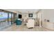 Bright living room featuring water view, with sliding glass doors to the outdoor deck at 1601 Park Beach Cir # 114/4, Punta Gorda, FL 33950