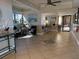 A spacious condo lobby area featuring tile floors, seating, and views from the adjacent windows at 1601 Park Beach Cir # 114/4, Punta Gorda, FL 33950
