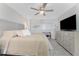 Spacious main bedroom featuring a large bed, dresser, and a cozy bench near the window at 1601 Park Beach Cir # 114/4, Punta Gorda, FL 33950