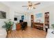 Comfortable home office featuring a desk, bookshelves, and wood laminate floors at 1601 Park Beach Cir # 114/4, Punta Gorda, FL 33950