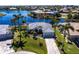 Stunning aerial view of a waterfront home with lush landscaping and a private pool at 17115 Barcrest Ln, Punta Gorda, FL 33955