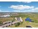 Condo complex with beautiful pond views, lush green spaces, and ample parking at 175 Kings Hwy # 717, Punta Gorda, FL 33983