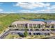 Aerial view of the condo complex near a scenic waterway and lush greenery at 175 Kings Hwy # 717, Punta Gorda, FL 33983