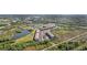 Community with multiple buildings, private lake, pool and parking areas, surrounded by nature at 175 Kings Hwy # 717, Punta Gorda, FL 33983