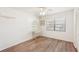 Clean and bright bedroom with wood flooring and a ceiling fan at 175 Kings Hwy # 717, Punta Gorda, FL 33983