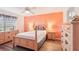 Bedroom with wood floors, a decorative headboard, ceiling fan and natural light at 175 Kings Hwy # 717, Punta Gorda, FL 33983