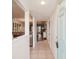 Inviting entryway with tile flooring leading to an open-concept kitchen and living area at 175 Kings Hwy # 717, Punta Gorda, FL 33983