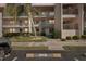 Well-kept condo building exterior with manicured landscaping and an assigned parking spot at 175 Kings Hwy # 717, Punta Gorda, FL 33983