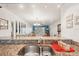 Granite countertops and a stainless steel sink offer a stylish view into the adjacent living space at 175 Kings Hwy # 717, Punta Gorda, FL 33983