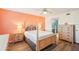 Spacious main bedroom with a four-poster bed and ample closet space at 175 Kings Hwy # 717, Punta Gorda, FL 33983