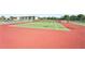 An eye-level view of the well-maintained community tennis courts on a sunny day at 175 Kings Hwy # 717, Punta Gorda, FL 33983