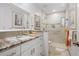 Updated bathroom features a walk-in shower, granite countertop, and modern fixtures at 196 The Corso # 196, Venice, FL 34285