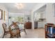 Bright dining area featuring a glass table set with views into the living room at 196 The Corso # 196, Venice, FL 34285