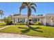 Charming single-story home with a well-manicured lawn and lush landscaping in a serene neighborhood at 196 The Corso # 196, Venice, FL 34285