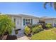 Inviting single-story home with well-maintained landscaping, lush greenery, and charming curb appeal at 196 The Corso # 196, Venice, FL 34285