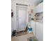 Functional laundry room with washer, dryer, and ample storage space at 196 The Corso # 196, Venice, FL 34285
