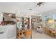 Versatile office space with a cozy nook, desk and shelving at 196 The Corso # 196, Venice, FL 34285
