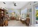 Bright sunroom with tile floors, shutters, providing a relaxing space at 196 The Corso # 196, Venice, FL 34285