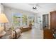 Cozy sunroom with tile flooring, plantation shutters, and comfortable seating at 196 The Corso # 196, Venice, FL 34285