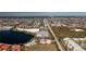 This aerial shot features a building near a lake, canal homes, and nearby shopping at 2001 Bal Harbor Blvd # 2202, Punta Gorda, FL 33950