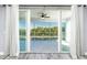 View from living room through sliding glass doors to balcony at 2001 Bal Harbor Blvd # 2202, Punta Gorda, FL 33950
