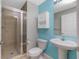 Bathroom with a shower, toilet, and a pedestal sink at 2001 Bal Harbor Blvd # 2202, Punta Gorda, FL 33950