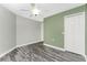 Bedroom with hardwood floors, ceiling fan, and double closet at 2001 Bal Harbor Blvd # 2202, Punta Gorda, FL 33950