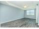 Spacious bedroom with modern ceiling fan and a large window at 2001 Bal Harbor Blvd # 2202, Punta Gorda, FL 33950