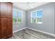 This bedroom features wood-look floors, natural light from two windows, and ample closet space at 2001 Bal Harbor Blvd # 2202, Punta Gorda, FL 33950