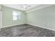 Bedroom with hardwood floors and a window with blinds at 2001 Bal Harbor Blvd # 2202, Punta Gorda, FL 33950