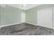 Bedroom with hardwood floors, ceiling fan, and a closet with sliding doors at 2001 Bal Harbor Blvd # 2202, Punta Gorda, FL 33950