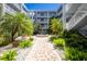 Lovely courtyard view shows lush landscaping, walking paths and a central fountain feature at 2001 Bal Harbor Blvd # 2202, Punta Gorda, FL 33950