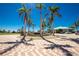 A grand entrance is framed by palm trees, tropical landscaping and an ornate water fountain feature at 2001 Bal Harbor Blvd # 2202, Punta Gorda, FL 33950