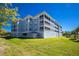 The exterior of this stylish multi-story condo complex features lawn, ample windows and charming balconies at 2001 Bal Harbor Blvd # 2202, Punta Gorda, FL 33950
