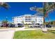 Well maintained building with mature landscaping and palm trees at 2001 Bal Harbor Blvd # 2202, Punta Gorda, FL 33950