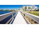 A beautiful waterfront view with a dock at a multi-story condo complex under a bright blue sky at 2001 Bal Harbor Blvd # 2202, Punta Gorda, FL 33950