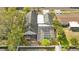 Aerial view of the house showcasing the screened in pool, roof and landscaping at 2027 59Th N St, Clearwater, FL 33760