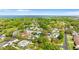 Community with mature trees near a body of water and a bridge in the distance at 2027 59Th N St, Clearwater, FL 33760